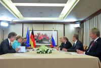Меркель и Путин обсудили выполнение Минских соглашений и сирийский кризис