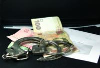 В Житомирской области задержан полицейский при получении взятки в 65 тыс. гривен