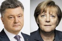 МП.Порошенко и А.Меркель обсудили прекращение огня на Донбассе и освобождение заложников