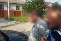 Под Днепром офицер полиции пойман на взятке в $1 тысячу - СБУ (видео)
