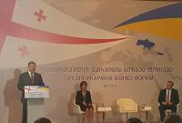 Порошенко в Грузии выступил на фоне баннера с ошибкой в названии Украины