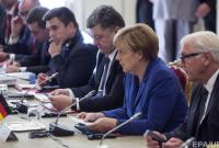Меркель и Макрон призвали Путина и Порошенко выполнить перемирие