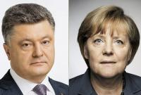 Меркель и Порошенко договорились привлечь Германию и Францию для возвращения российских наблюдателей на Донбасс