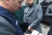 В Киеве главного специалиста НБУ поймали на взятке в $40 тысяч (фото)