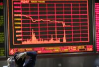 Китайские биржи во второй раз за неделю упали на 7%