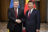 Порошенко и глава КНР в Давосе договорились об обмене визитами