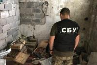 В Донецкой области СБУ обнаружила схрон со средствами поражения и оружием