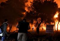 В Греции спасатели вторые сутки пытаются ликвидировать крупный лесной пожар под Афинами