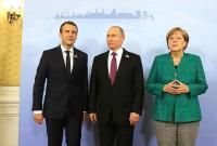 Макрон і Меркель закликали Путіна врегулювати конфлікт на Донбасі